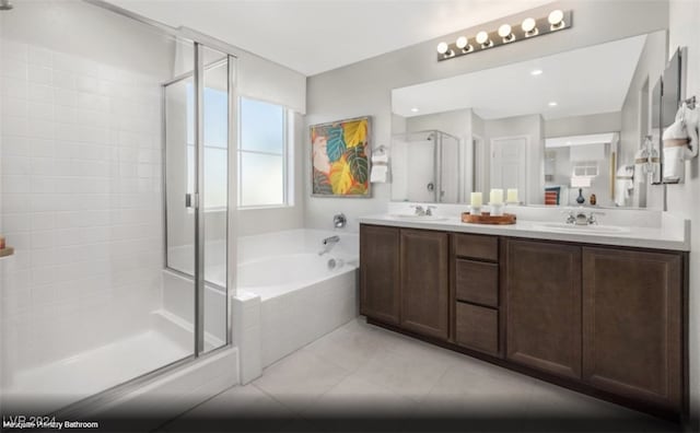 bathroom featuring vanity, tile patterned floors, and separate shower and tub