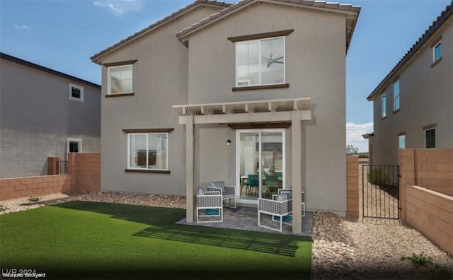 back of house with a patio, a yard, and a pergola