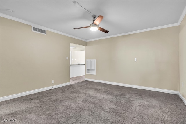 carpeted empty room featuring ornamental molding and ceiling fan