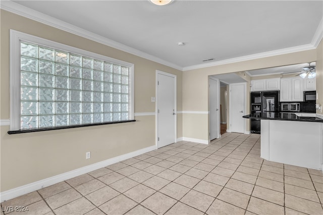 kitchen featuring ornamental molding, black appliances, light tile patterned floors, and white cabinets