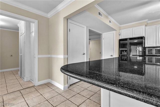 kitchen featuring light tile patterned floors, white cabinetry, dark stone counters, black fridge with ice dispenser, and crown molding