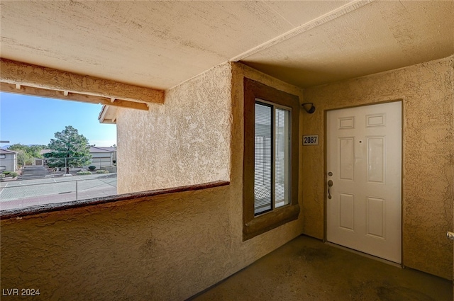 doorway to property featuring a balcony