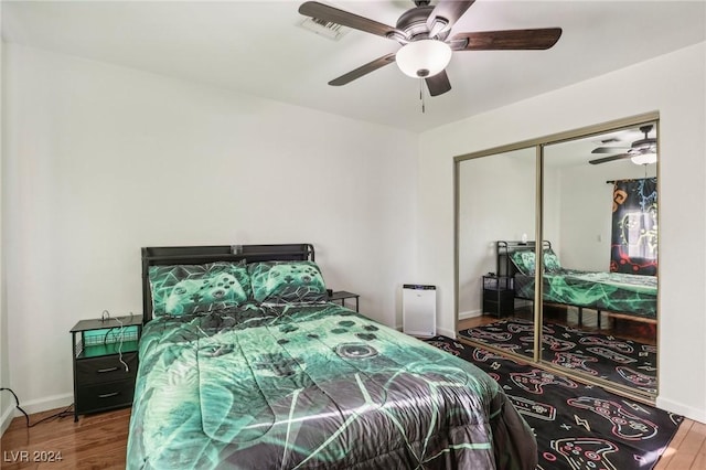 bedroom featuring a closet, ceiling fan, and hardwood / wood-style floors