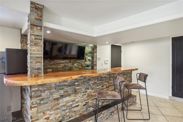 bar with light tile patterned flooring