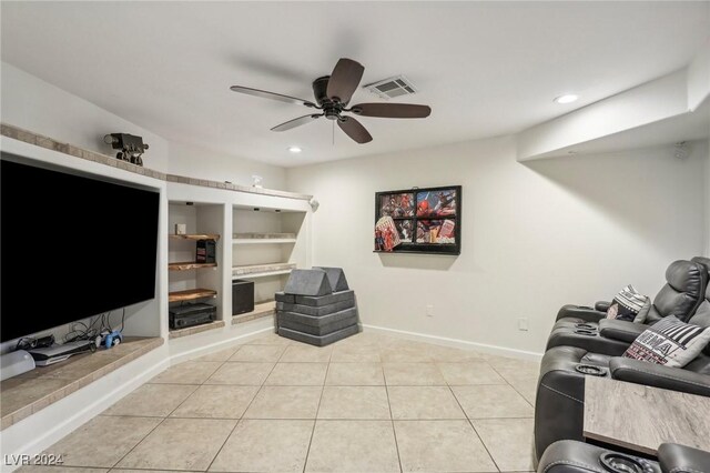 living room featuring ceiling fan and light tile patterned floors