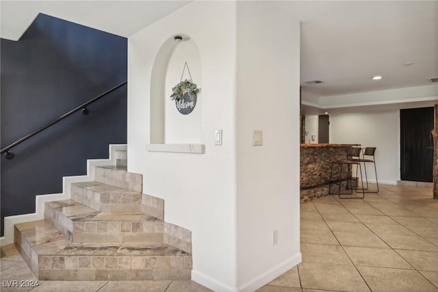 stairs with tile patterned flooring