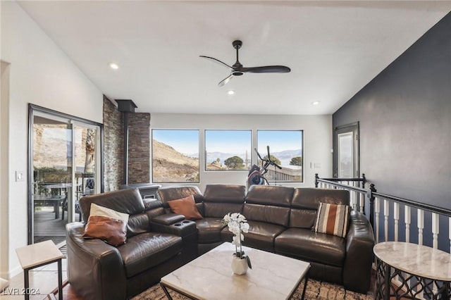 living room featuring a mountain view, ceiling fan, and lofted ceiling