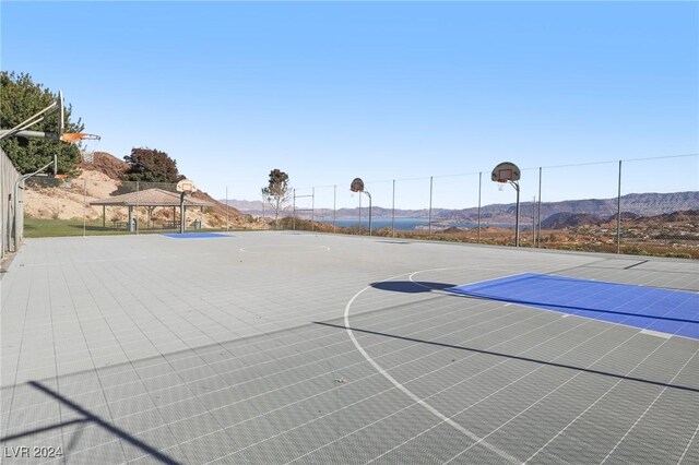 view of basketball court featuring a mountain view and a gazebo