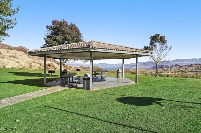 surrounding community featuring a mountain view, a gazebo, a yard, and a patio area