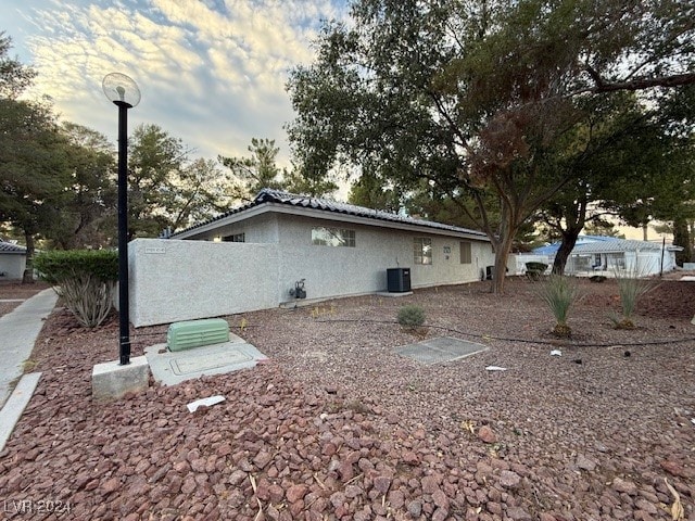 view of property exterior featuring central AC unit