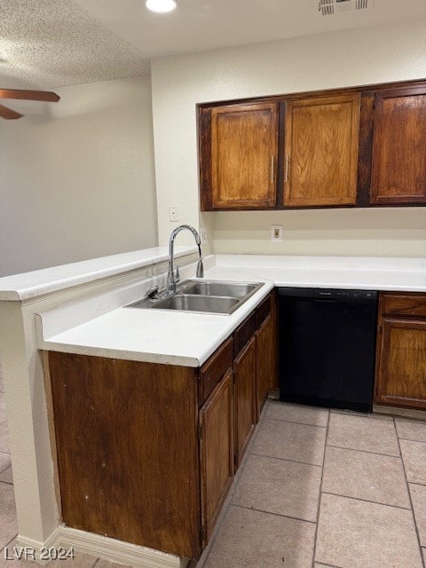 kitchen featuring black dishwasher, sink, a textured ceiling, kitchen peninsula, and ceiling fan