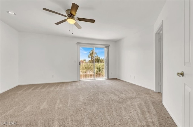 empty room with carpet floors and ceiling fan