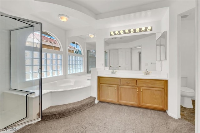 full bathroom with vanity, toilet, and shower with separate bathtub