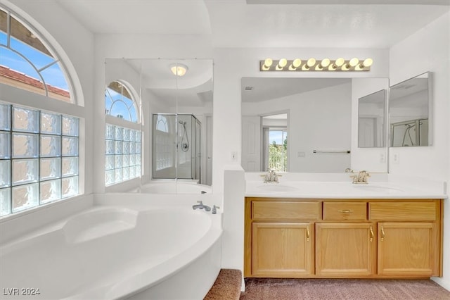 bathroom with vanity and plus walk in shower