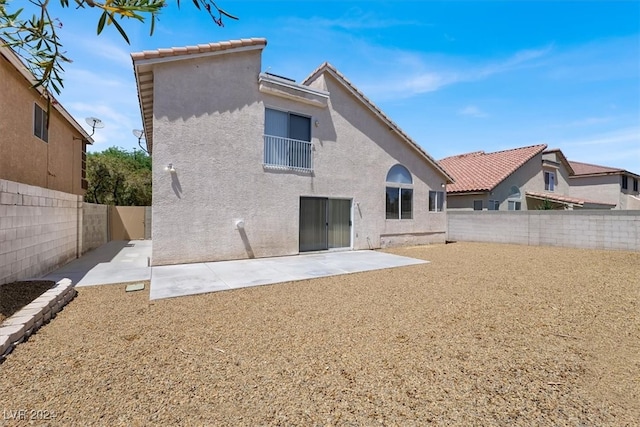 back of property with a patio area