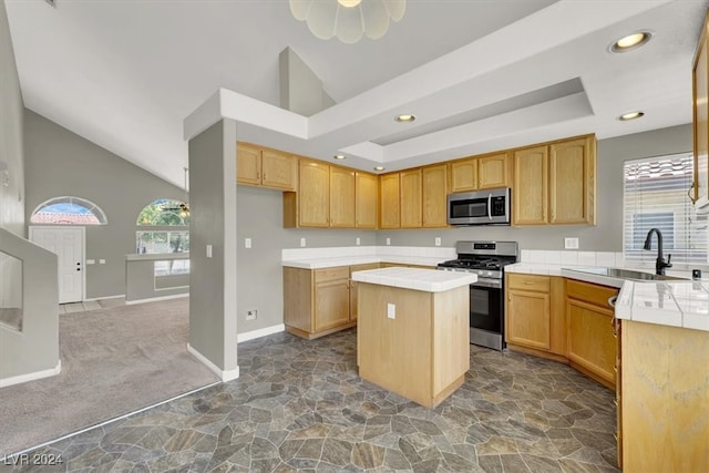 kitchen featuring dark carpet, a kitchen island, stainless steel appliances, and high vaulted ceiling