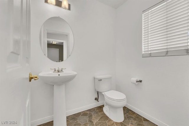 bathroom with sink and toilet