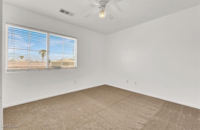 carpeted empty room with ceiling fan