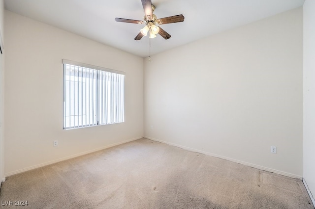 carpeted empty room with ceiling fan