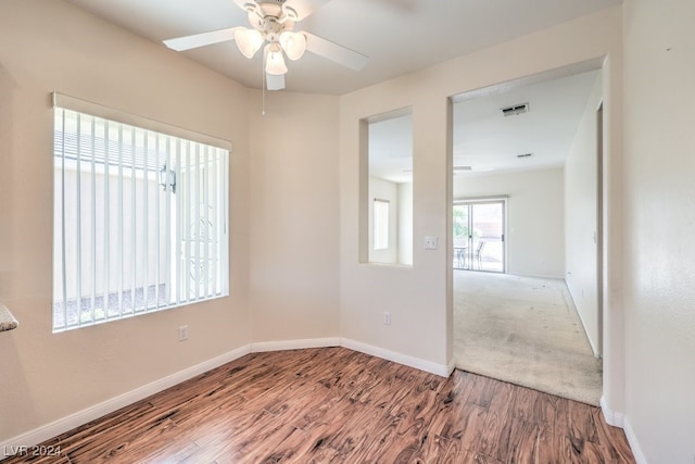 unfurnished room featuring ceiling fan and hardwood / wood-style flooring