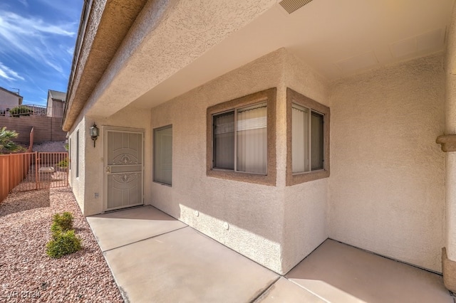 entrance to property with a patio area