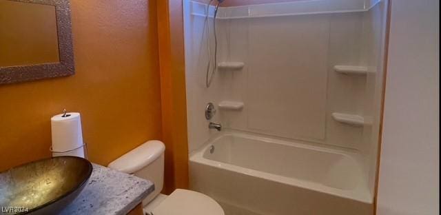 full bathroom with vanity, shower / bath combination, and toilet