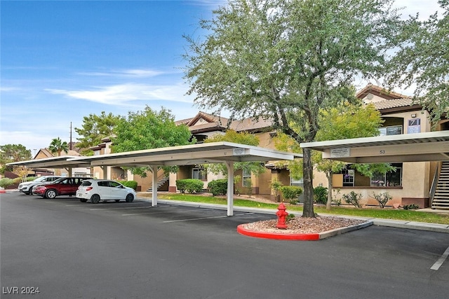 view of vehicle parking with a carport