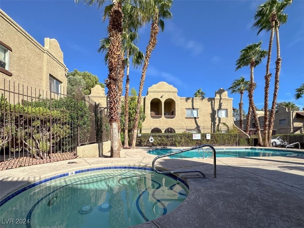 view of swimming pool with a patio area