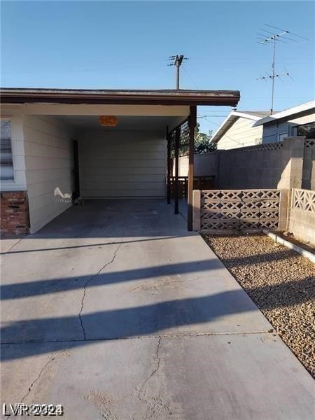 exterior space with a carport