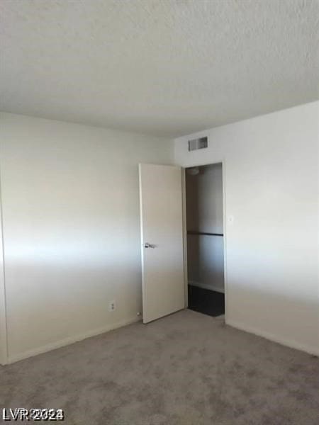 empty room featuring carpet floors