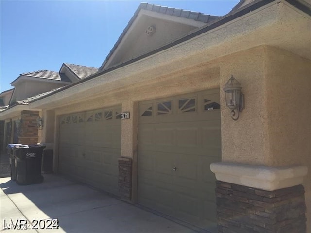 view of side of property with a garage