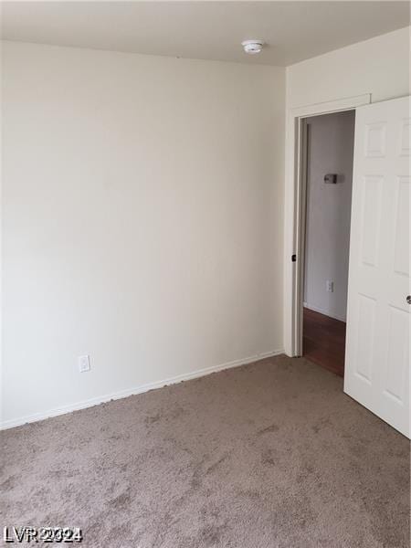 1929 Evelyn Ave, Henderson, NV 89011 - carpeted spare room with a smoke detector and baseboards