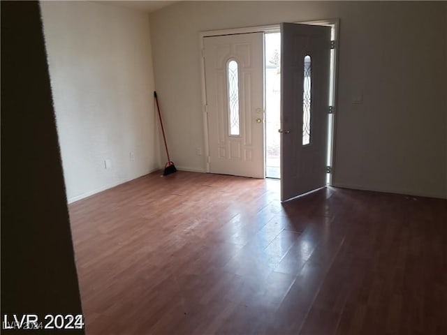 foyer with dark hardwood / wood-style floors