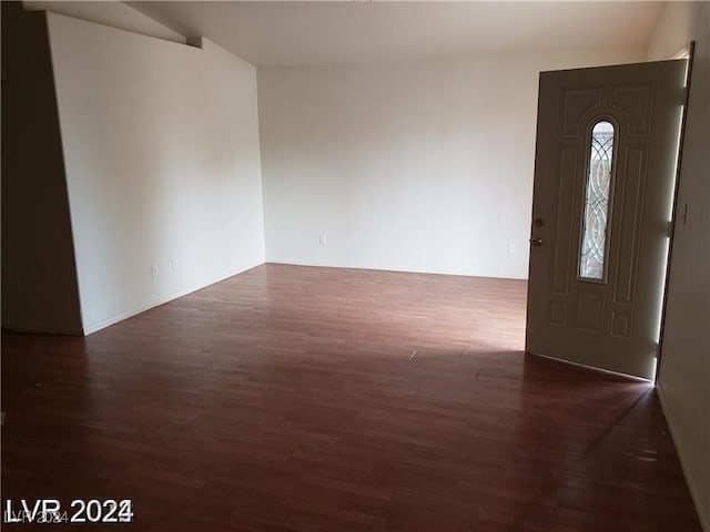 foyer with dark hardwood / wood-style flooring