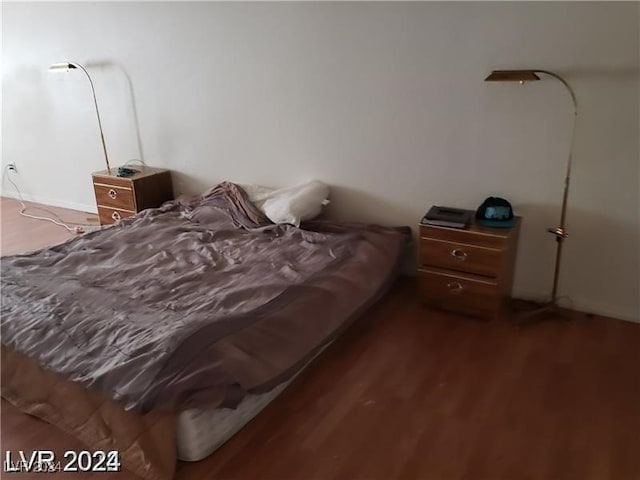 bedroom featuring dark wood-type flooring