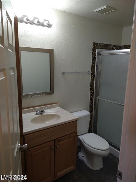 1929 Evelyn Ave, Henderson, NV 89011 - bathroom featuring vanity, a shower stall, and tile patterned floors