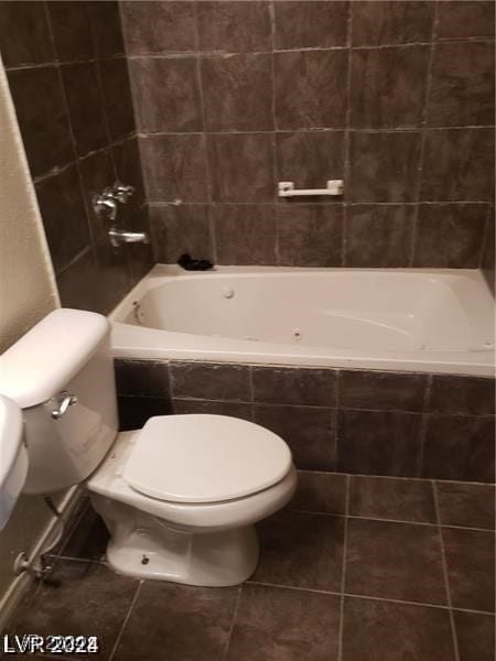 bathroom featuring tile patterned floors and toilet