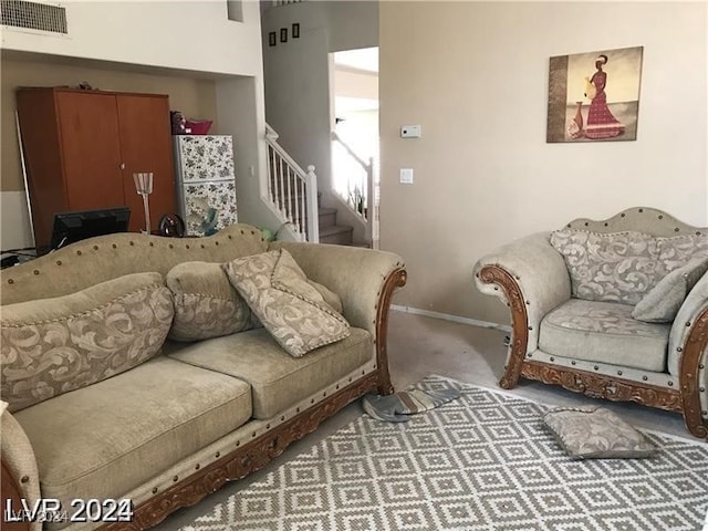 living room featuring light carpet