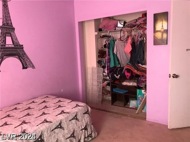 bedroom featuring a closet and carpet flooring