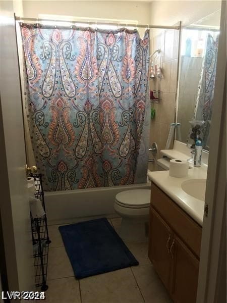 full bathroom featuring vanity, shower / bath combination with curtain, toilet, and tile patterned floors