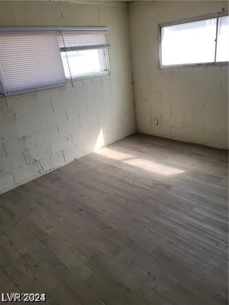 spare room with hardwood / wood-style flooring