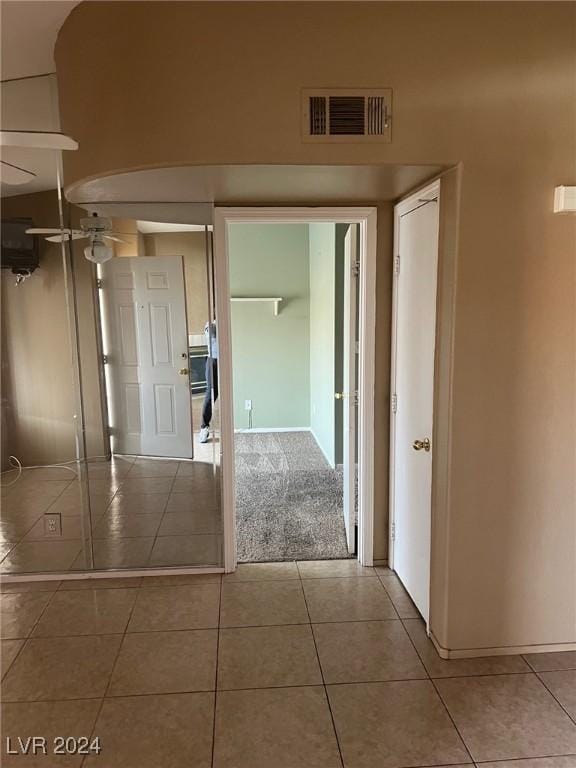 corridor featuring tile patterned flooring