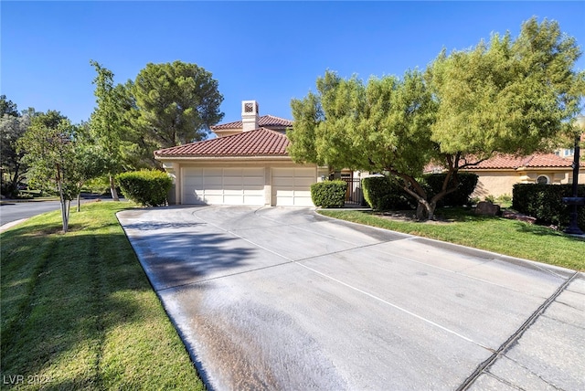 view of front facade featuring a front yard and a garage