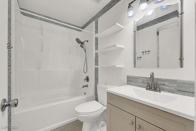 full bathroom featuring backsplash, vanity, wood-type flooring, washtub / shower combination, and toilet