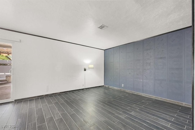 unfurnished room featuring dark hardwood / wood-style floors