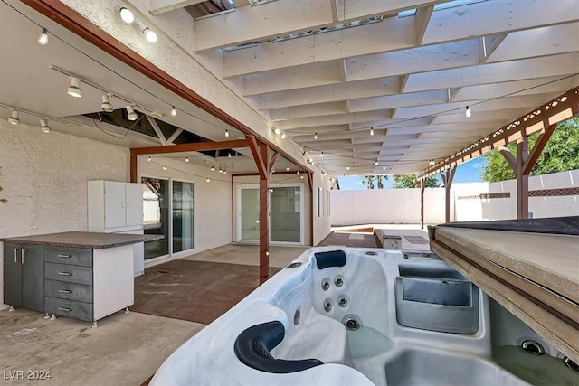 view of patio / terrace featuring a hot tub