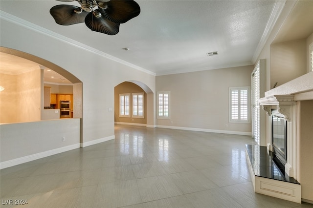 unfurnished living room with ornamental molding