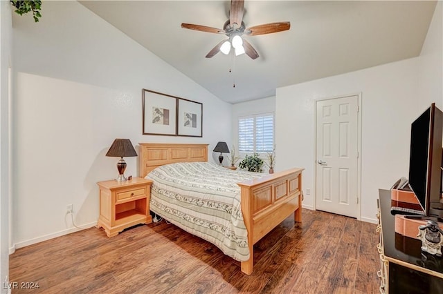 bedroom with a ceiling fan, baseboards, wood finished floors, and lofted ceiling
