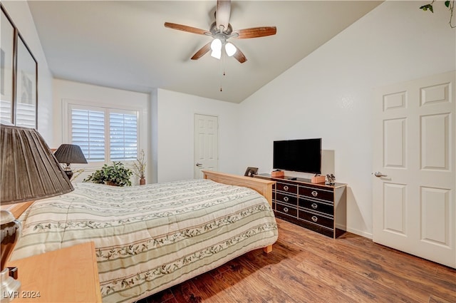 bedroom featuring lofted ceiling, hardwood / wood-style floors, and ceiling fan