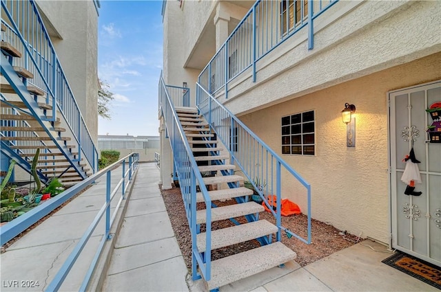 property entrance featuring stucco siding